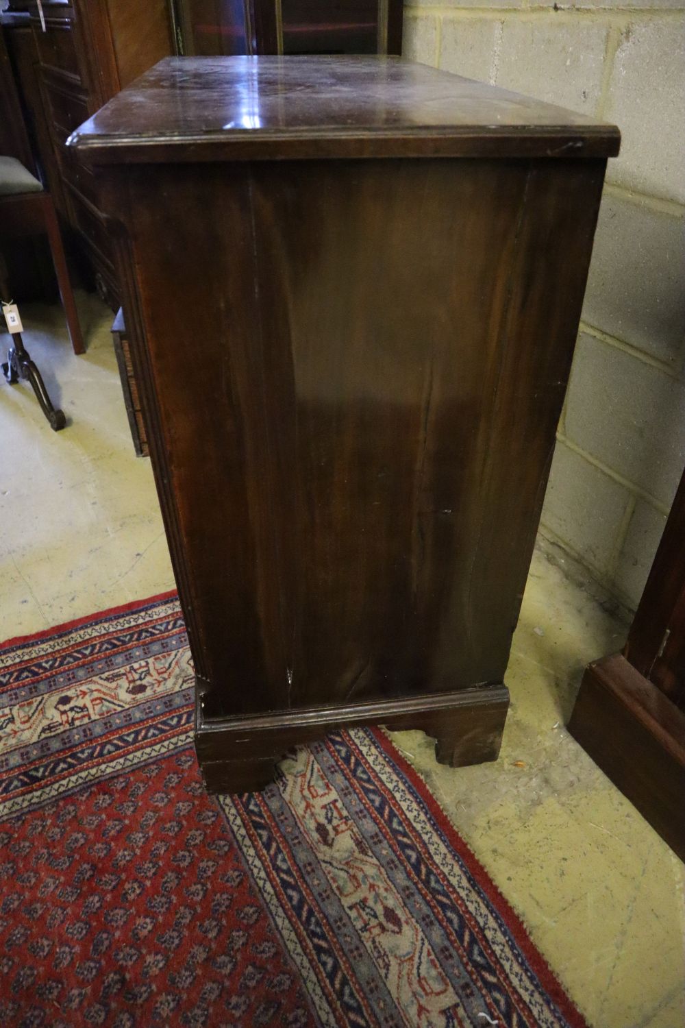 A George III walnut kneehole desk, width 90cm, depth 42cm, height 86cm